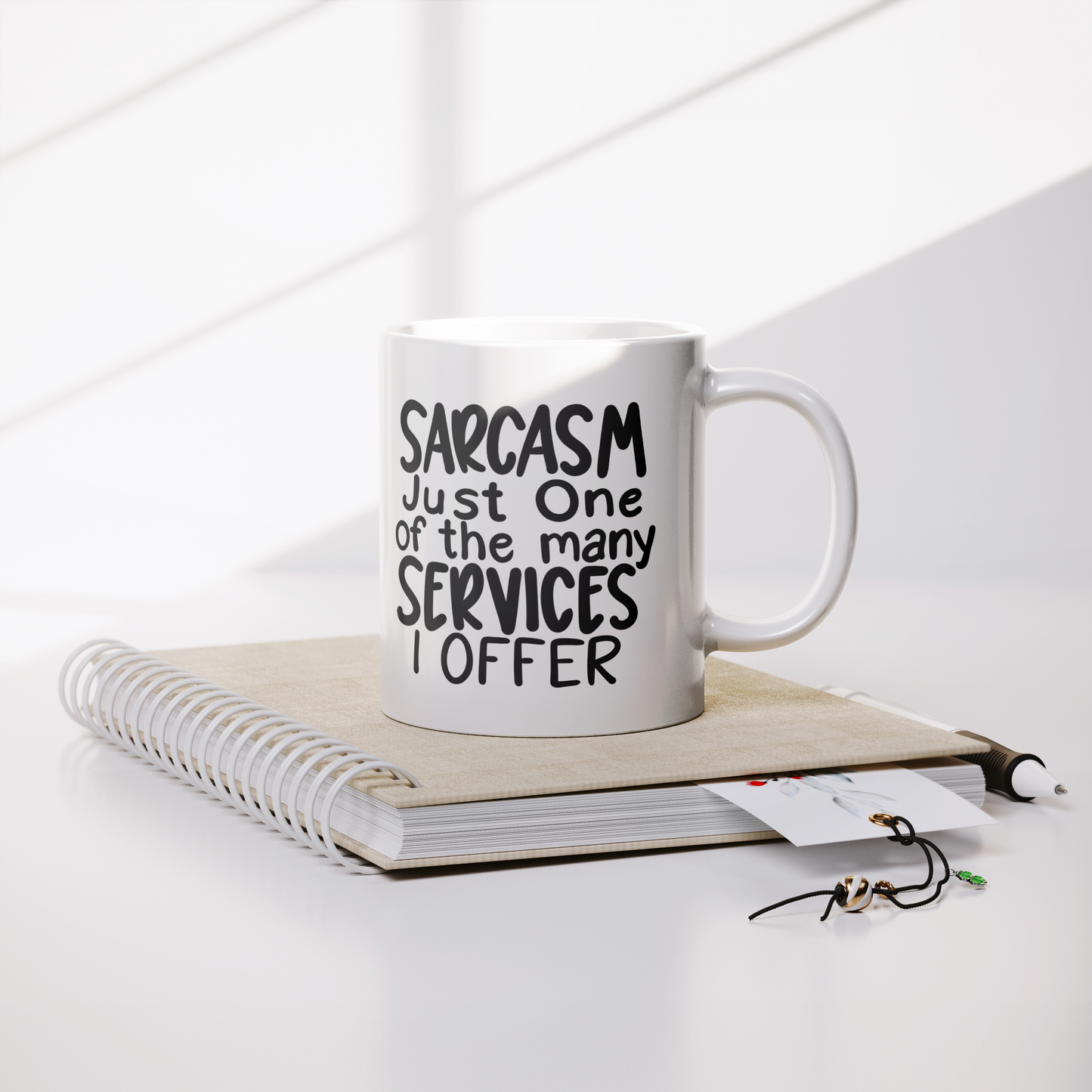 Funny_Coffee_Mug__Sarcasm_Just_On_Lifestyle_Notebook_Mockup.png